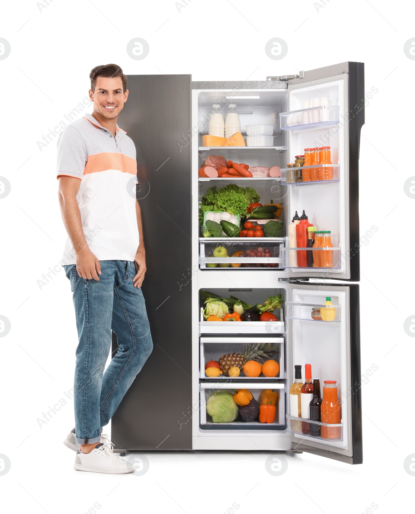 Photo of Man near open refrigerator on white background