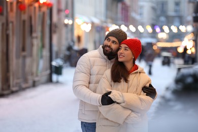 Photo of Lovely couple spending time together on city street