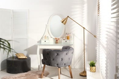 Stylish room interior with elegant dressing table