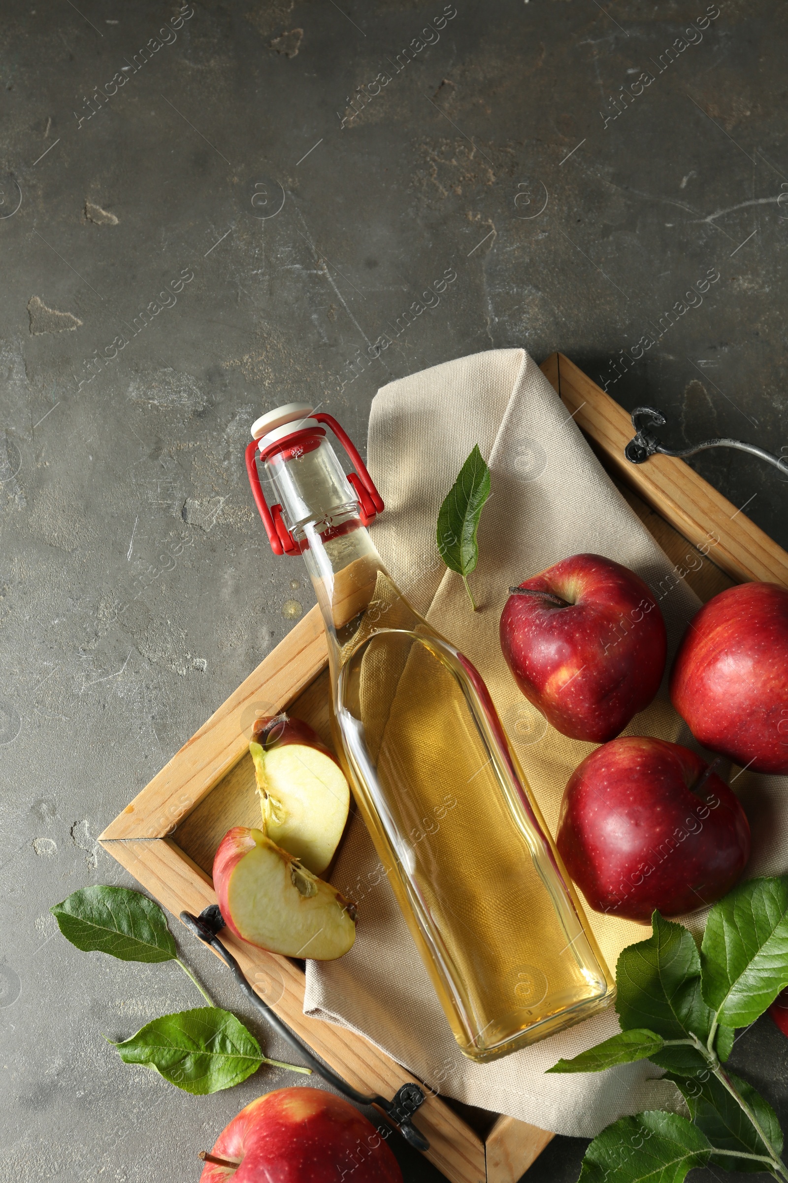 Photo of Flat lay composition with delicious apple cider on gray table
