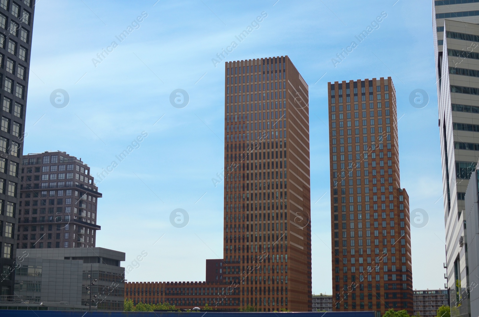 Photo of Exterior of beautiful modern skyscrapers against blue sky