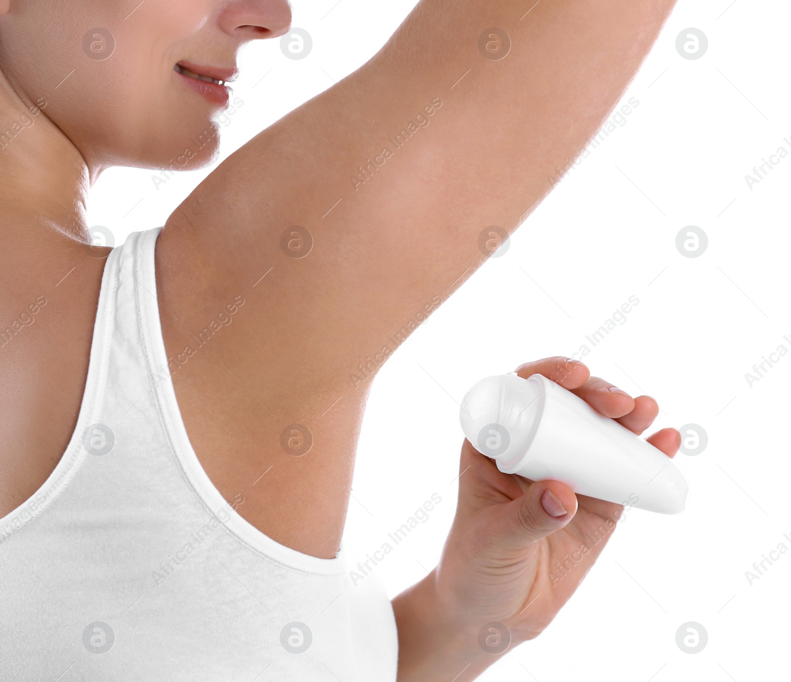 Photo of Young woman using deodorant on white background, closeup