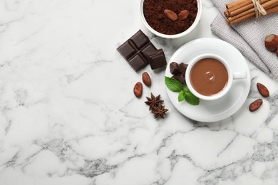 Photo of Flat lay composition with yummy hot chocolate on white marble table, space for text