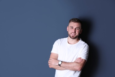 Photo of Portrait of handsome happy man on grey background, space for text