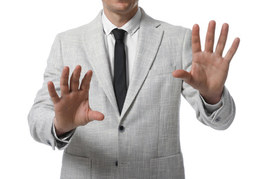 Businessman touching something on white background, closeup