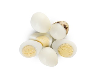 Photo of Peeled hard boiled quail eggs and another one partly in shell on white background, top view