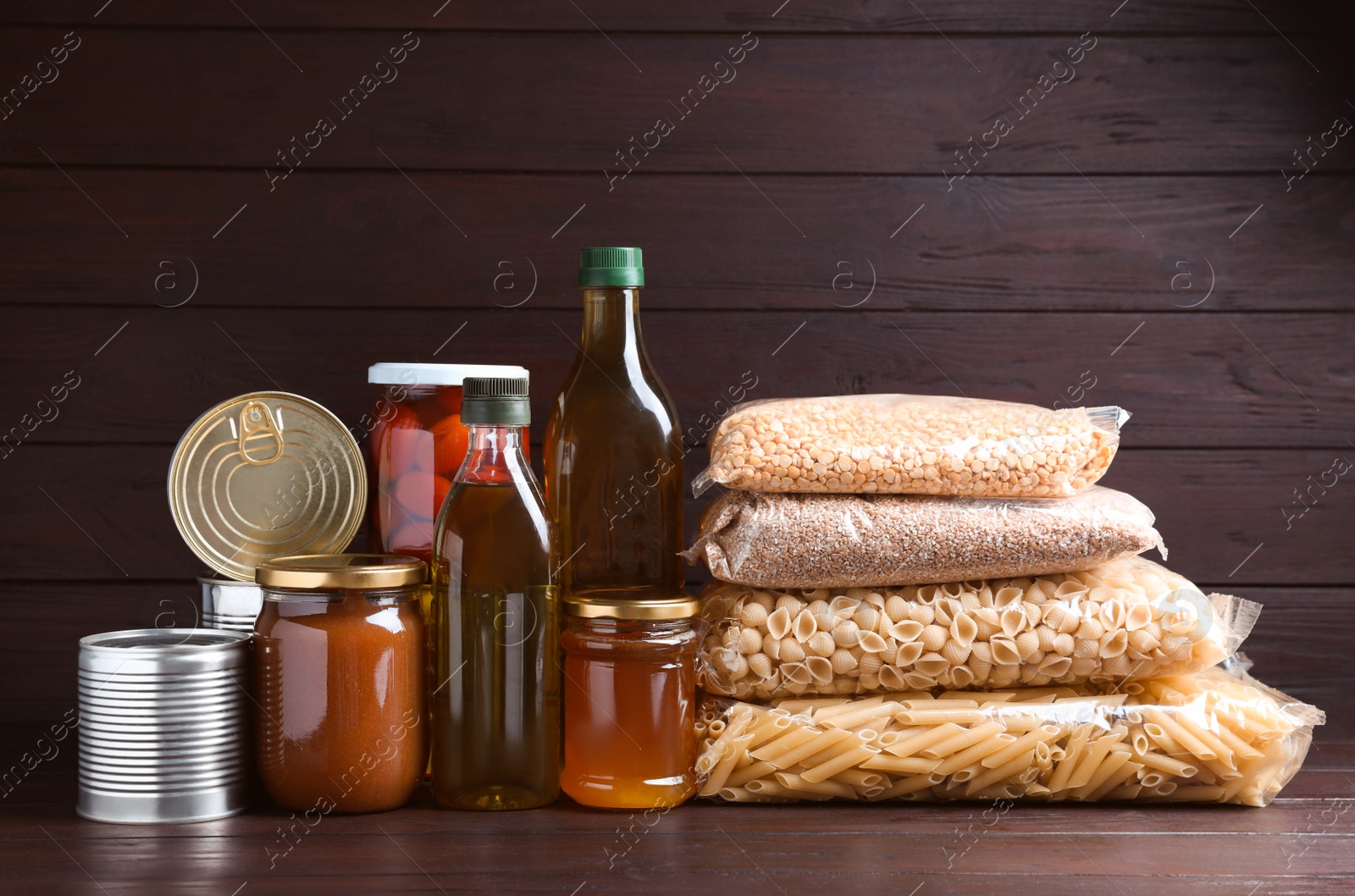 Photo of Different products on wooden table. Food donation