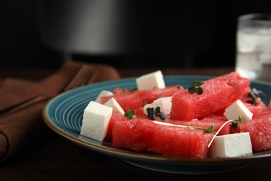 Photo of Delicious salad with watermelon and feta cheese on plate, closeup