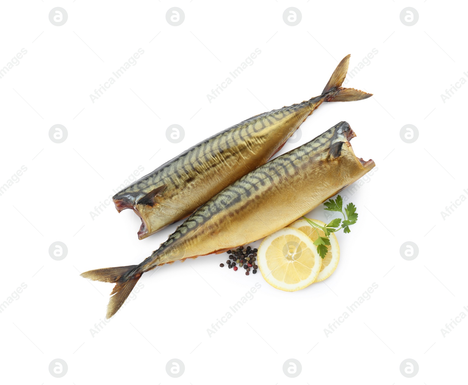 Photo of Delicious smoked mackerels, lemon slices and spices on white background, top view