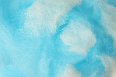 Photo of Sweet blue cotton candy as background, closeup view