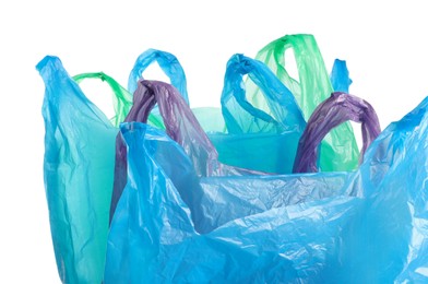 Photo of Many different plastic bags on white background