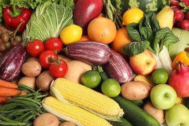 Photo of Assortment of fresh organic fruits and vegetables as background, top view
