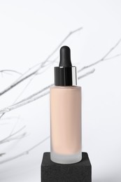 Photo of Bottle of skin foundation on white background. Makeup product