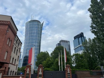 Photo of WARSAW, POLAND - JULY 13, 2022: Beautiful viewmodern buildings on city street