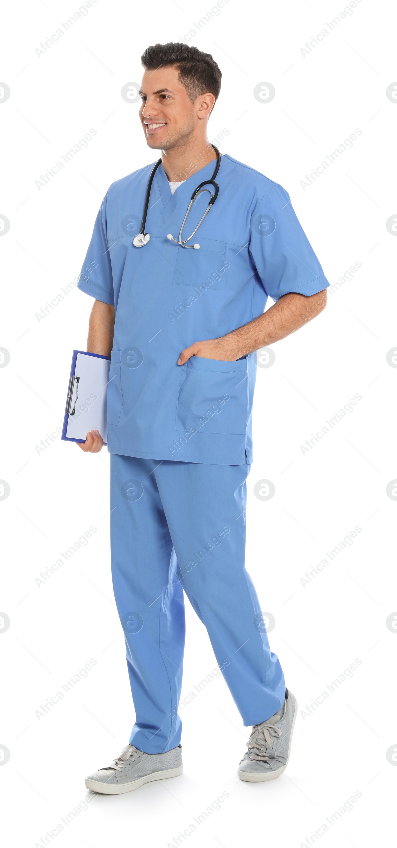 Photo of Full length portrait of medical doctor with clipboard and stethoscope isolated on white