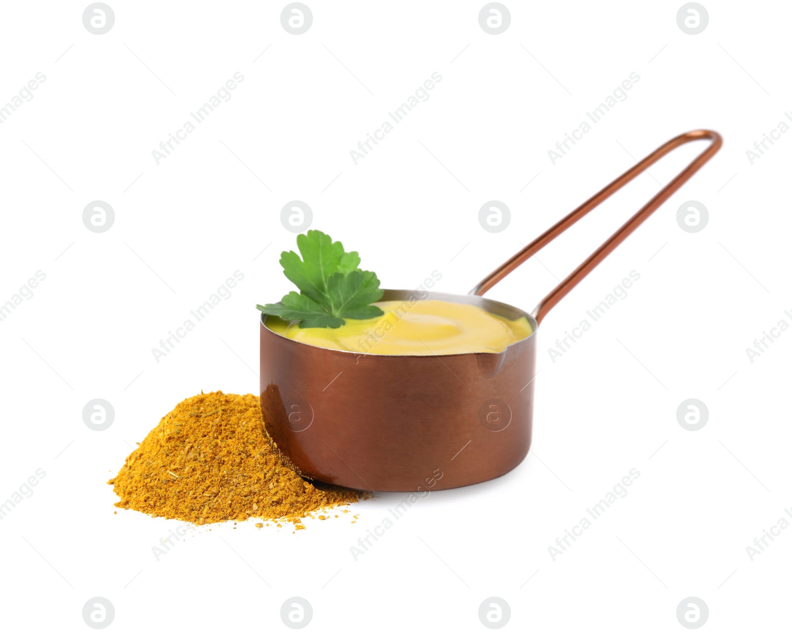 Photo of Saucepan with tasty curry sauce, powder and parsley isolated on white