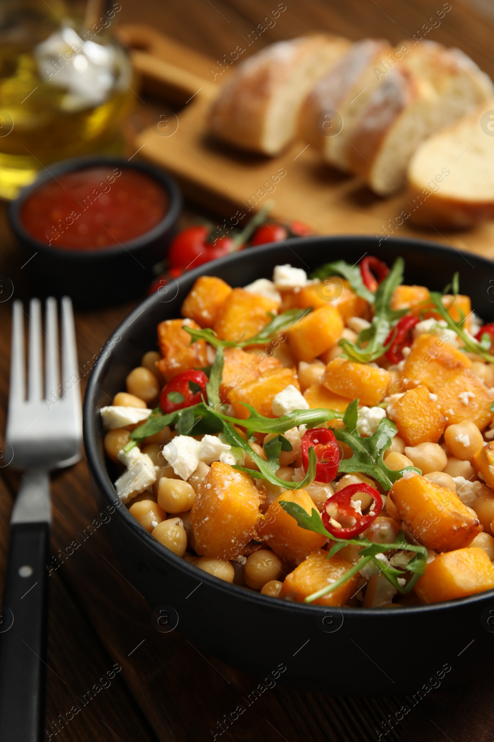 Photo of Delicious fresh chickpea salad served on table