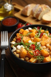 Delicious fresh chickpea salad served on table