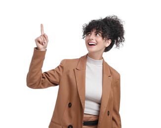 Photo of Beautiful happy businesswoman pointing at something on white background