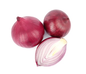 Fresh whole and cut red onions on white background, top view