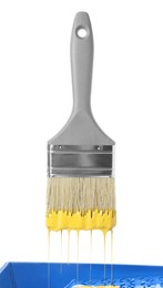 Photo of One brush with yellow paint isolated on white