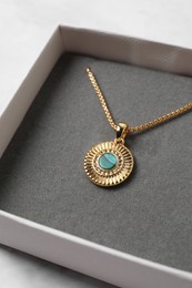 Photo of Beautiful necklace in jewel box, closeup view