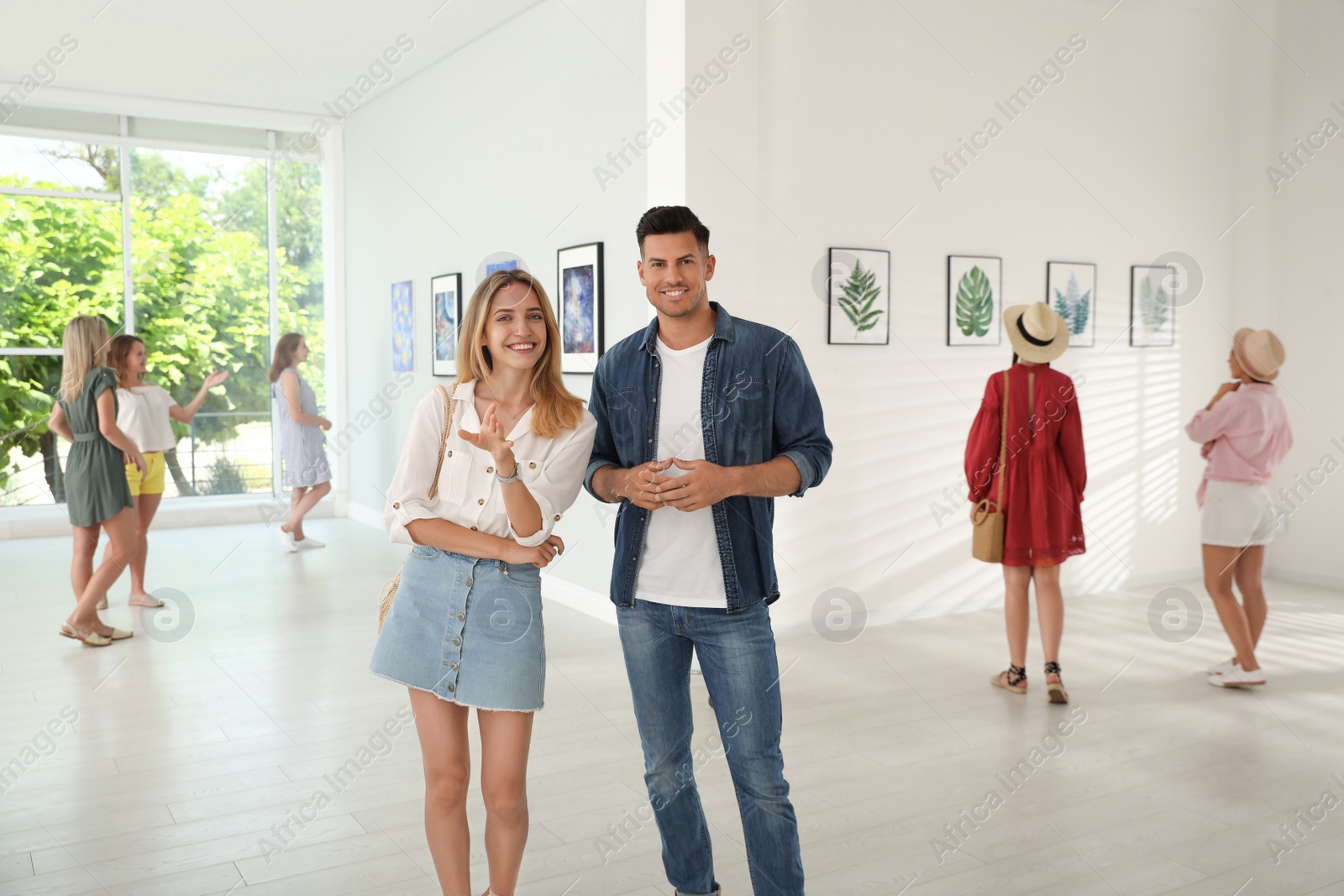 Photo of Happy couple at exhibition in art gallery