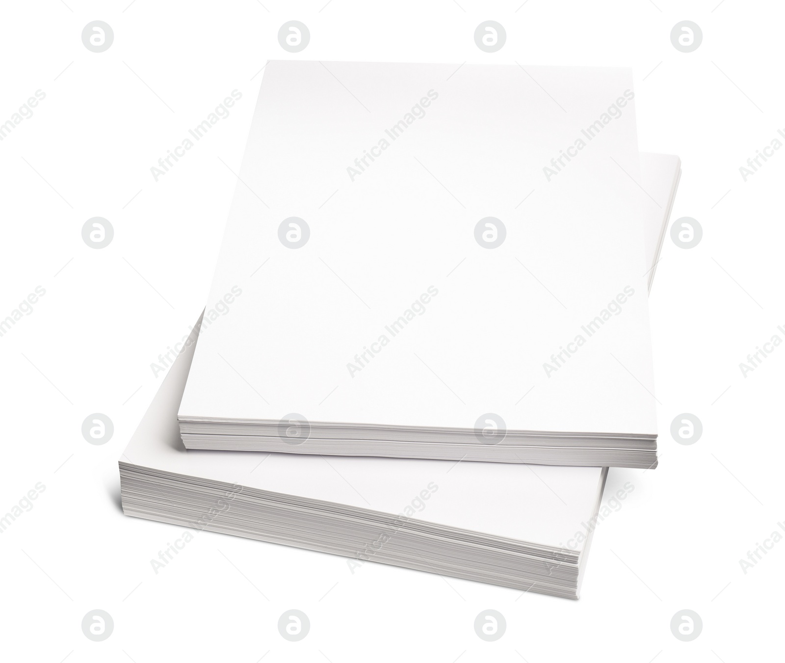 Photo of Stacks of paper sheets on white background