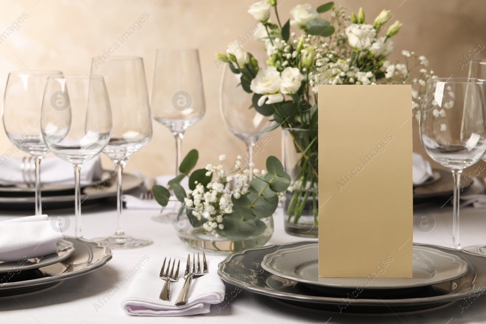 Photo of Stylish elegant table setting for festive dinner in restaurant