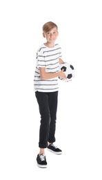 Portrait of young boy holding soccer ball on white background