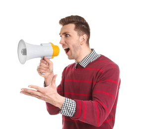 Young man shouting into megaphone on white background