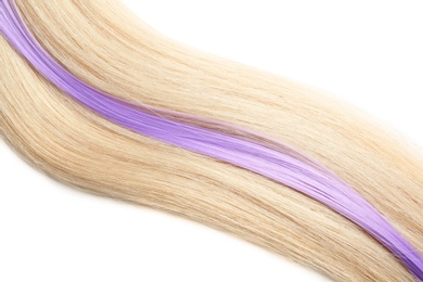 Photo of Locks of blond and violet hair on white background