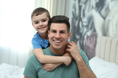 Dad and son spending time together at home. Happy Father's Day