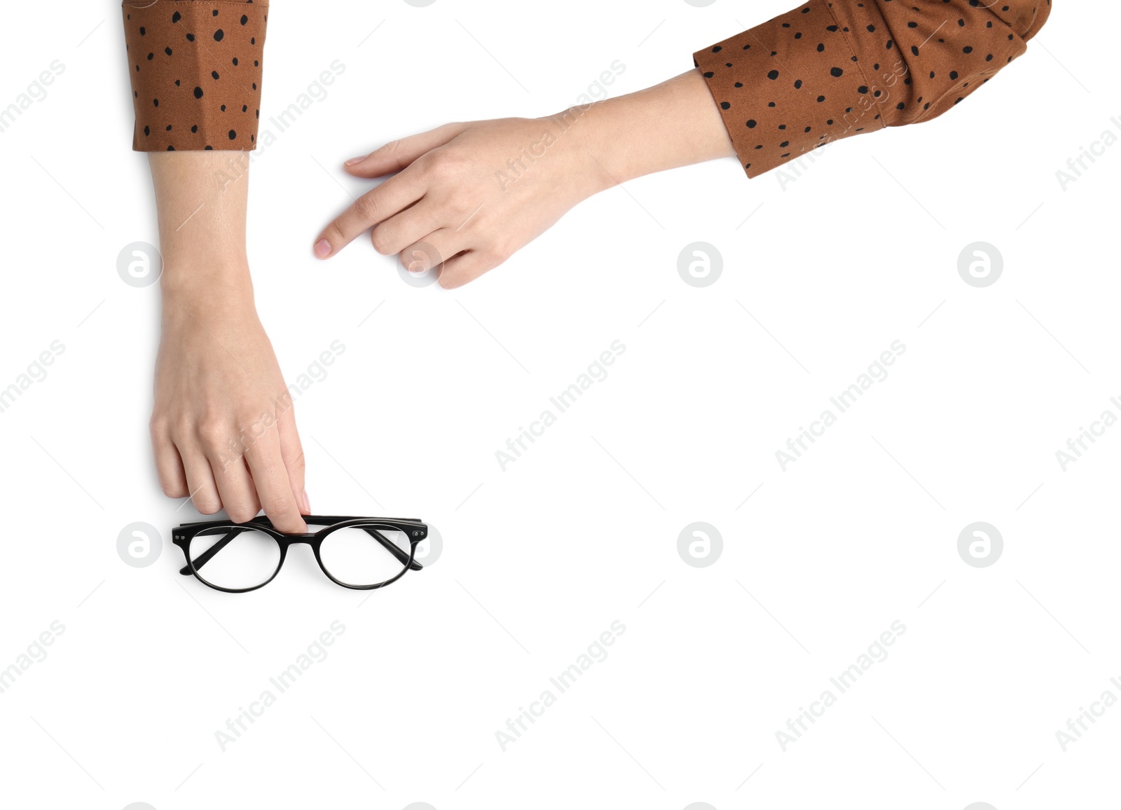 Photo of Woman with glasses on white background, top view. Closeup of hands