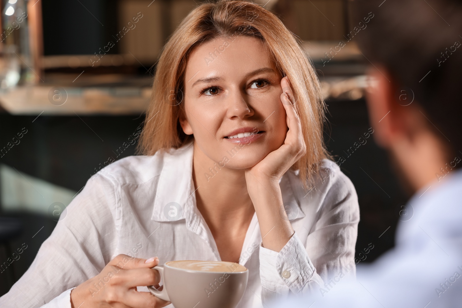 Photo of Romantic date. Happy couple spending time together in cafe