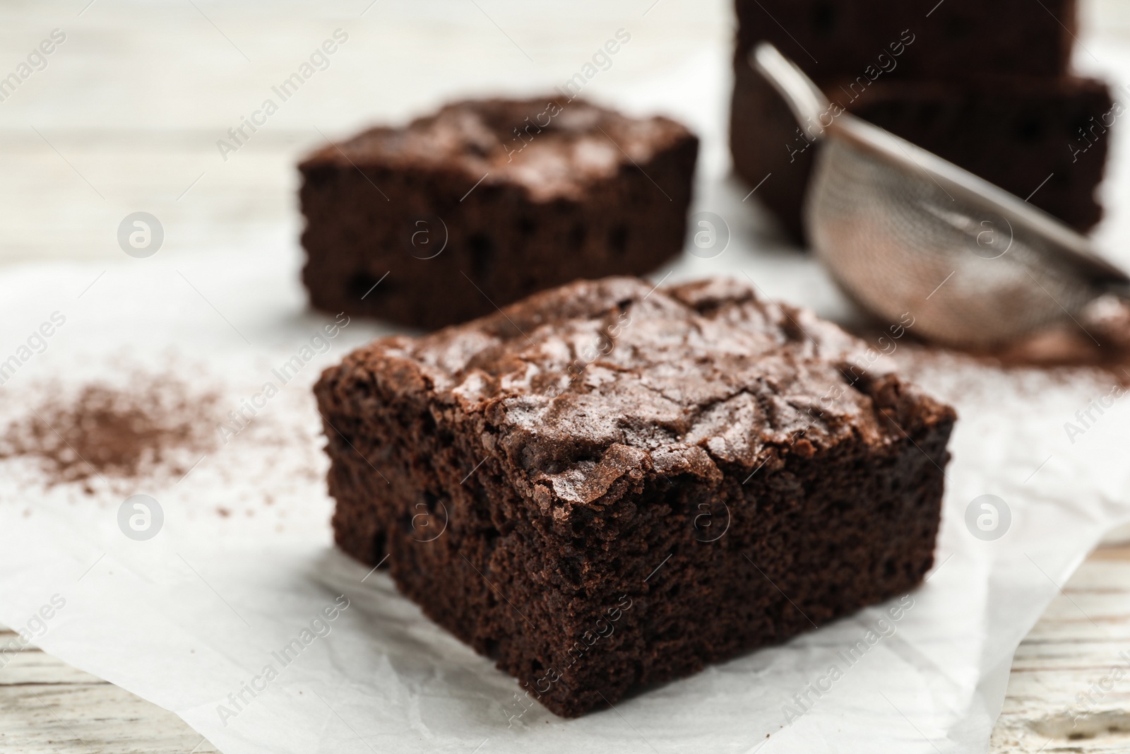 Photo of Fresh homemade brownies on table, closeup. Delicious chocolate pie