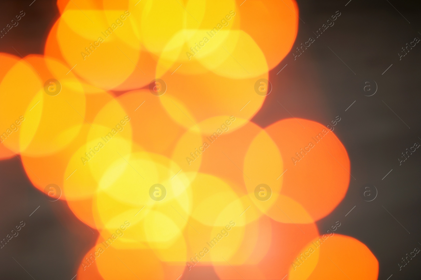 Photo of Beautiful gold lights on dark background. Bokeh effect