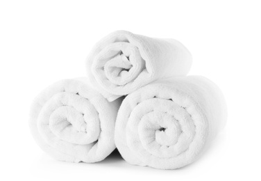 Photo of Rolled fresh clean towels on white background
