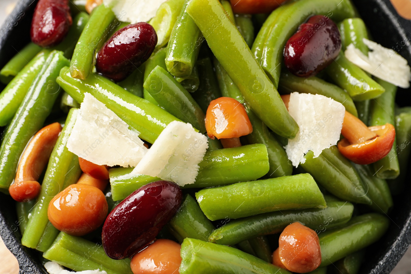 Photo of Delicious salad with green beans, mushrooms and cheese, closeup