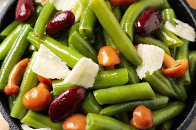 Photo of Delicious salad with green beans, mushrooms and cheese, closeup