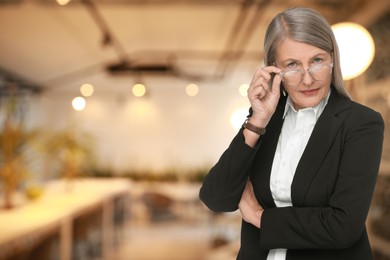 Lawyer, consultant, business owner. Confident woman with eyeglasses indoors, space for text