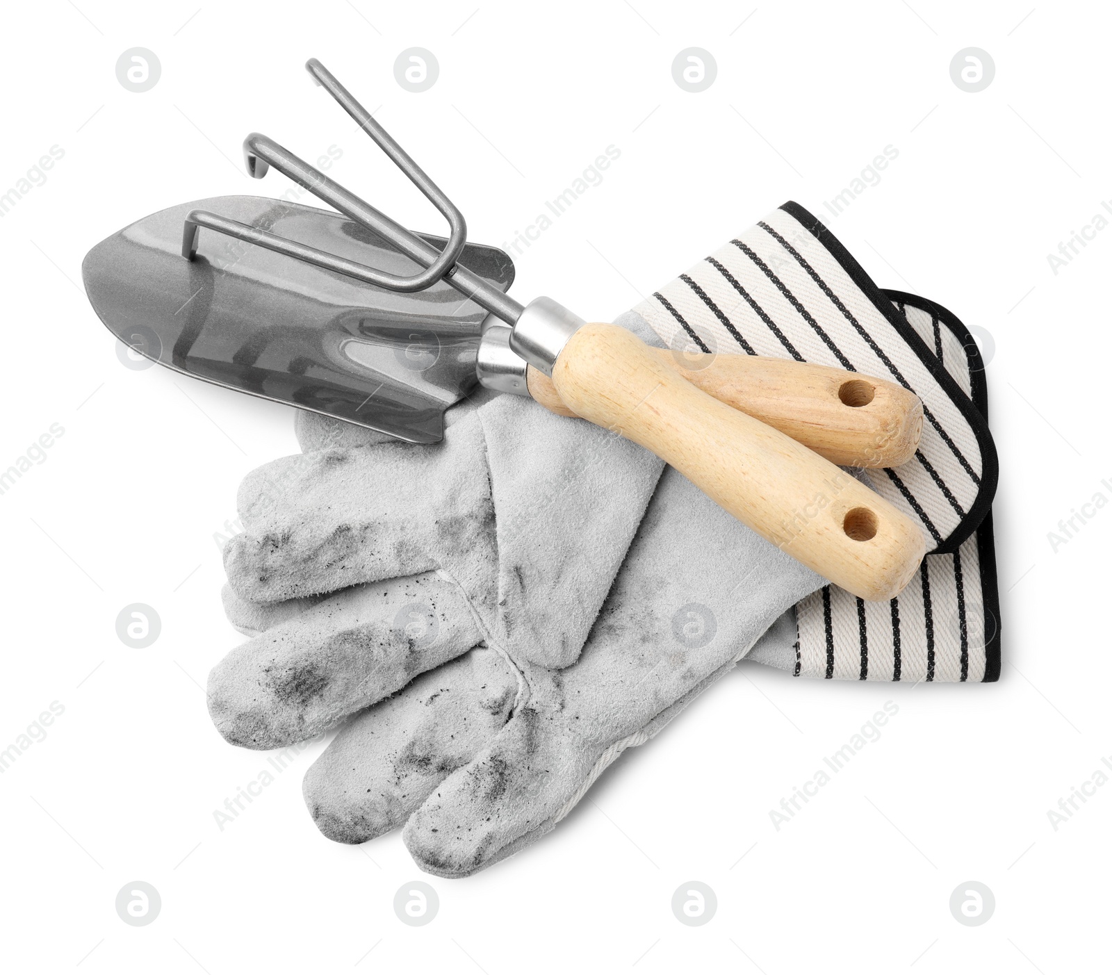 Photo of Gardening gloves, trowel and rake isolated on white, above view
