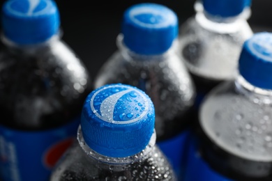 MYKOLAIV, UKRAINE - FEBRUARY 08, 2021: Plastic bottles of Pepsi with water drops, closeup