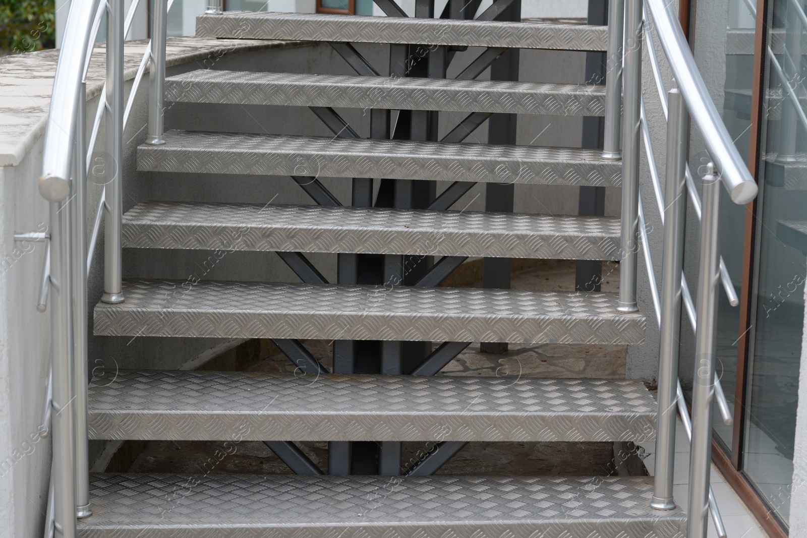 Photo of View of beautiful metal stairs with railings outdoors