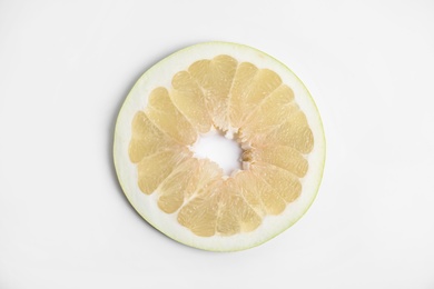 Photo of Slice of delicious ripe pomelo on white background, top view