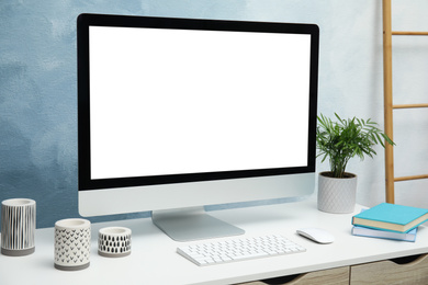 Comfortable workplace with modern computer on table