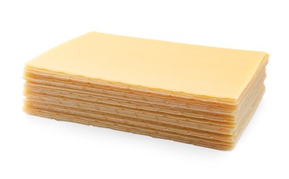 Photo of Stack of uncooked lasagna sheets isolated on white