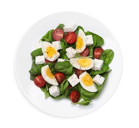 Delicious salad with boiled eggs, feta cheese and tomatoes isolated on white, top view