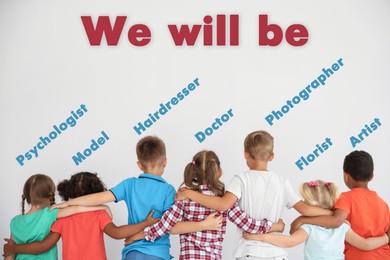 Image of Choice of profession. Inscription We Will Be and different occupations written over little children hugging each other on white background