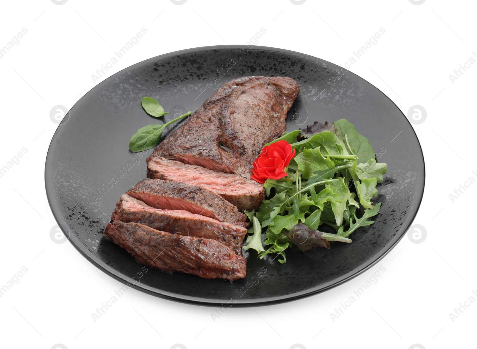 Photo of Pieces of delicious grilled beef meat and greens isolated on white